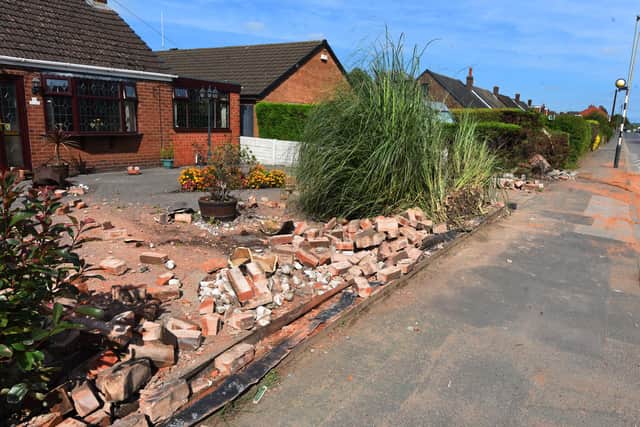 The scene on Lily Lane, Bamfurlong, after a car crashed into garden walls