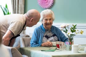 A staff member and resident at Langtree’s sister home, Worthington Lake.