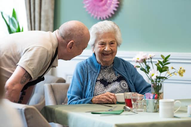 A staff member and resident at Langtree’s sister home, Worthington Lake.