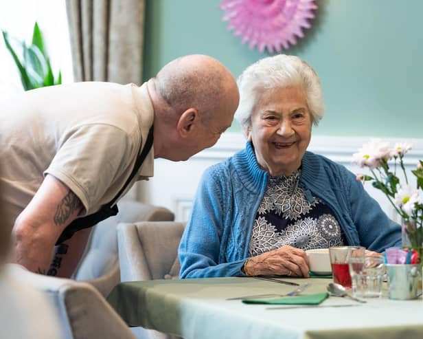 A staff member and resident at Langtree’s sister home, Worthington Lake.
