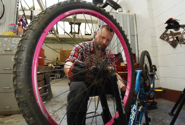 Mark gets to work on a bike