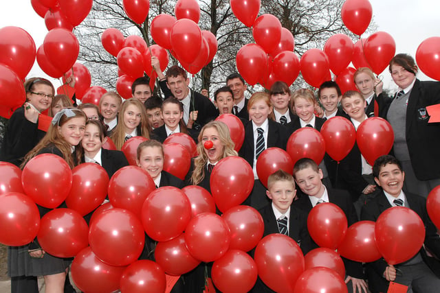 Up Holland High School deputy head girl Ashley Smith, 15, and fellow pupils before their Red Nose Day balloon race