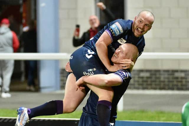 Liam Marshall celebrate with Liam Farrell