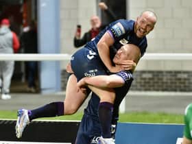 Liam Marshall celebrate with Liam Farrell