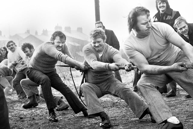 A tug of war contest over the Leeds to Liverpool canal on a frosty January day in New Springs in 1974.