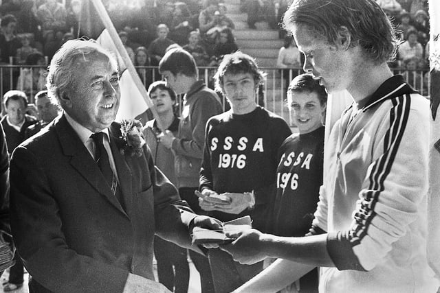 Harold Wilson, who had resigned as Prime Minister 4 days earlier, presents awards at the English Schools Swimming International organised by local teachers at Wigan International Pool on Saturday 20th of March 1976.