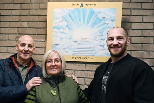 The family of Sam Leiper - dad Andy, mum Debby and brother Josh - at the unveiling of a painting in memory of him and other people who have died by suicide