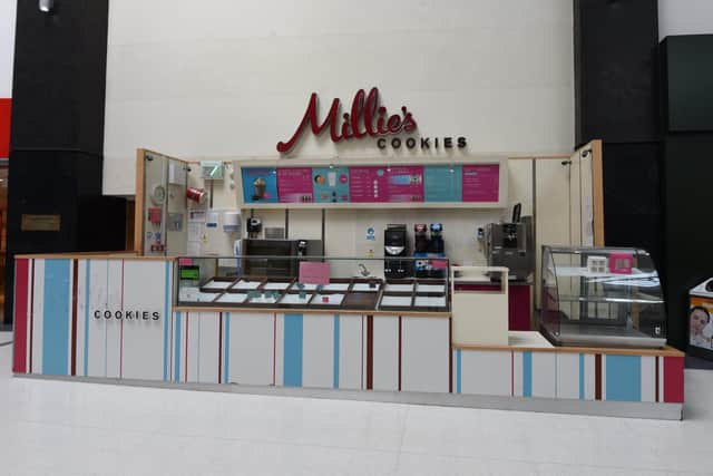 The empty Millie's Cookies kiosk