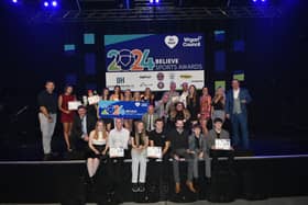 Winners and sponsors on stage.