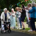 Friends, family, members of Ashton Deaf Club, neighbours and Mayor of St Helens Coun Lynn Clarke lined the streets to celebrate the end of Cath Brookfield's fund-raising challenge