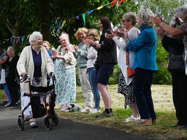 Friends, family, members of Ashton Deaf Club, neighbours and Mayor of St Helens Coun Lynn Clarke lined the streets to celebrate the end of Cath Brookfield's fund-raising challenge