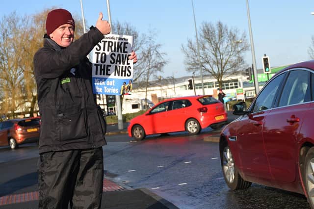 Garry Gallagher, who used to work for North West Ambulance Service, acknowledges the support of passing motorists at Saddle Junction