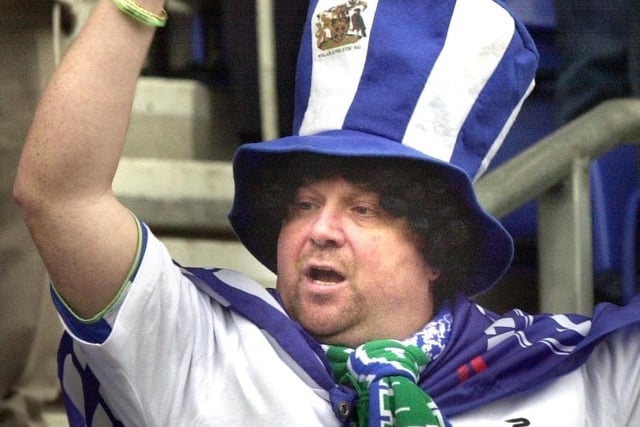 A Latics fan celebrates at the final whistle as Wigan Athletic lift the Division 2 championship trophy after beating Barnsley 1-0 with a Tony Dinning goal  on Saturday 3rd of May, the last day of the 2002/2003 season. 