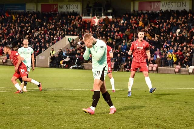 Stephen Humphrys can't believe it as his second-half penalty is saved by Cheltenham goalkeeper Luke Southwood