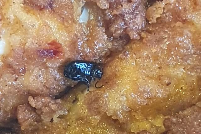 A beetle found inside the box of chicken wings ordered by Paul Cowley for him and his family to enjoy for his birthday treat.