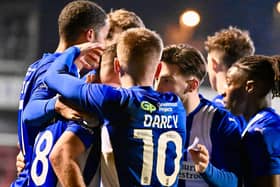 Dale Taylor fields the congratulations from his colleagues after opening the scoring