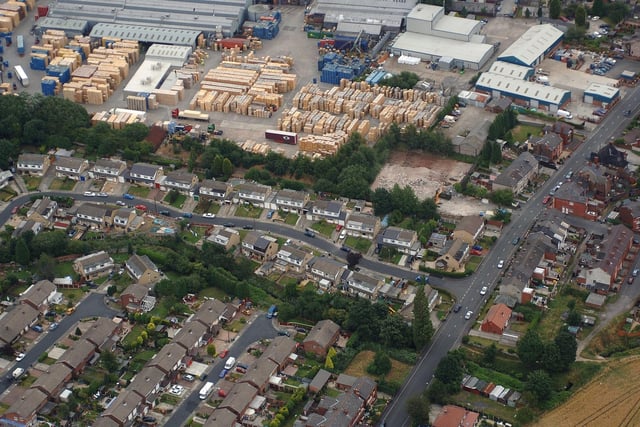 WIGAN AERIAL PICTURE - Homes and businesses in Golborne - the pallet works behind houses on Whitlow Avenue.