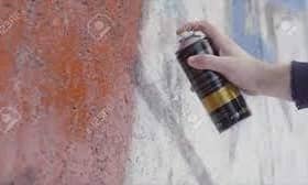 Stock image of hand holding spray can
