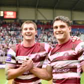 Ethan Havard with Liam Byrne after the victory over Warrington Wolves