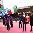 Jason Robinson helped to carry out the men's World Cup trophy (Photo by Alex Livesey/Getty Images for RLWC)