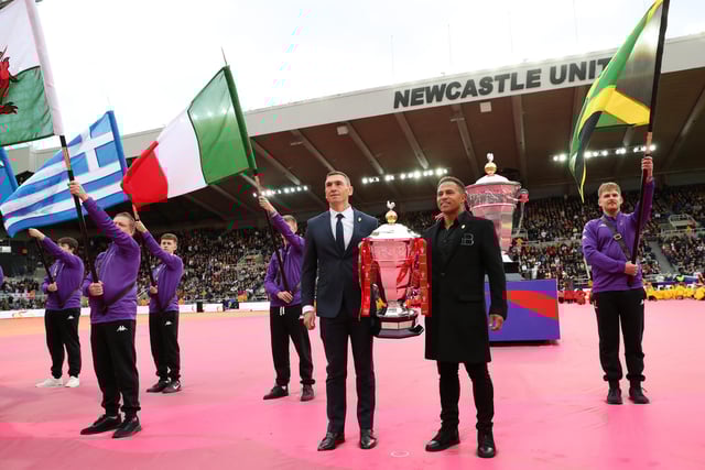 Jason Robinson helped to carry out the men's World Cup trophy (Photo by Alex Livesey/Getty Images for RLWC)