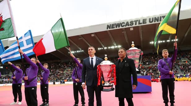 Jason Robinson helped to carry out the men's World Cup trophy (Photo by Alex Livesey/Getty Images for RLWC)