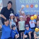Daisy Daycare Nursery children and staff after receiving their latest award, including (far right) owner/manager Jackie McElhatton
