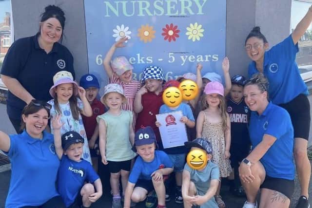 Daisy Daycare Nursery children and staff after receiving their latest award, including (far right) owner/manager Jackie McElhatton