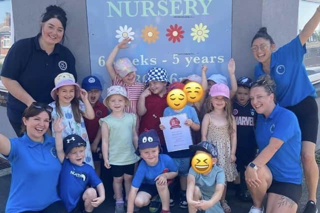 Daisy Daycare Nursery children and staff after receiving their latest award, including (far right) owner/manager Jackie McElhatton