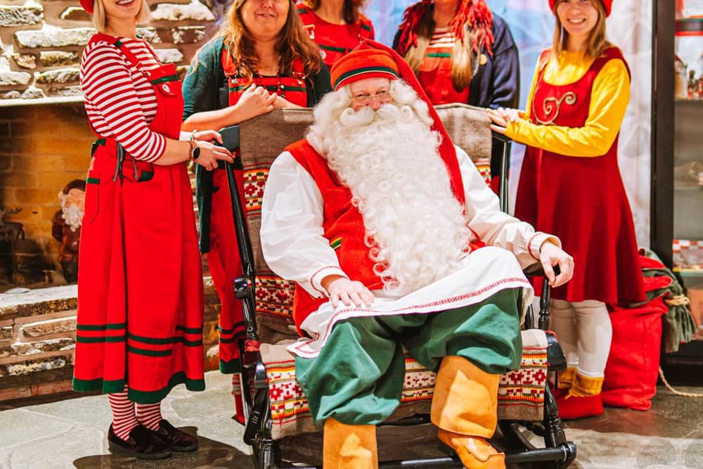 Santa Claus and his helpers ready to receive letters from around the world