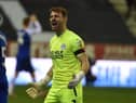 Jamie Jones celebrates a big win for Latics against Blackpool - as the players wait to discover who the new manager will be