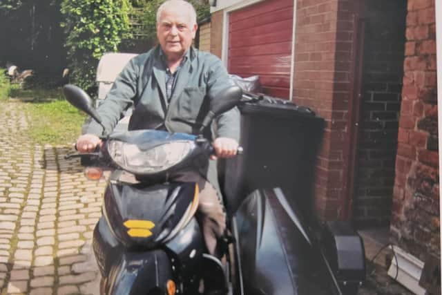 Les Hurst with his specially adapted bike with sidecar stabiliser