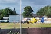 The North West air ambulance lands at Norley Cricket Club