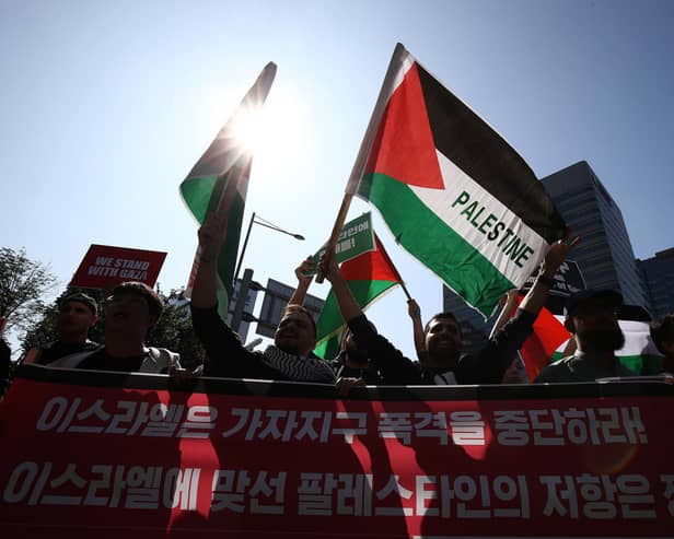 Protesters gather in support of the Palestinian people during a rally for Gaza on Wednesday in Seoul, South Korea
