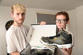 Jasmin Lyon and partner Aiden Gerrard have been living in a damp flat in Scholes, Wigan, for a year.  Their property is mouldy and their health is suffering.  Pictured with a new part of trainers which went mouldy in the shoebox because of the conditions in the accommodation.