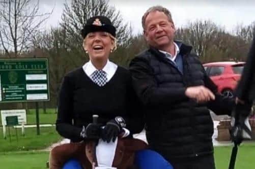 Fund-raising golfers Vicki Handley - a retired mounted police officer - and Jed Turner