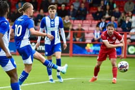 Chris Sze watches Thelo Aasgaard scores Latics' second goal at Accrington