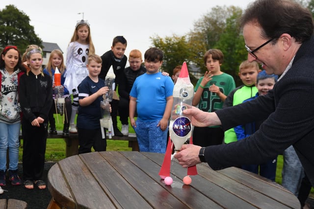 Neil West, education liaison of FAWNS (Forum of Aspull, Whelley and New Springs) demonstrates his space rocket.