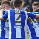 The Latics players celebrate at Lincoln