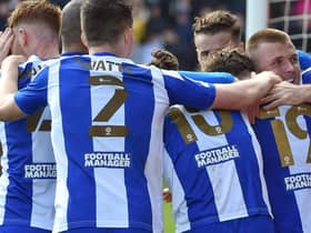 The Latics players celebrate at Lincoln