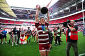 Brad O’Neill lifts the Challenge Cup trophy