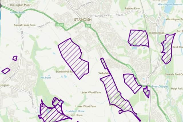 A map that shows some of the areas in Standish that Places For Everyone would protect from development marked in purple