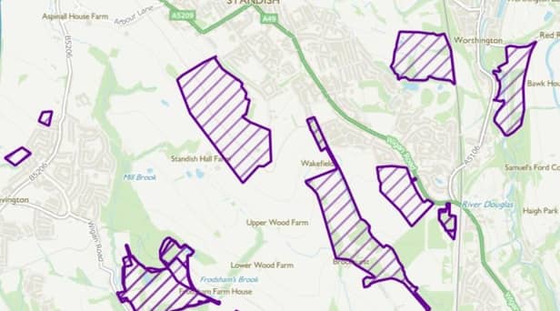 A map that shows some of the areas in Standish that Places For Everyone would protect from development marked in purple
