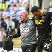 Josh Magennis is forced to limp from the field during the 1-1 draw at Reading