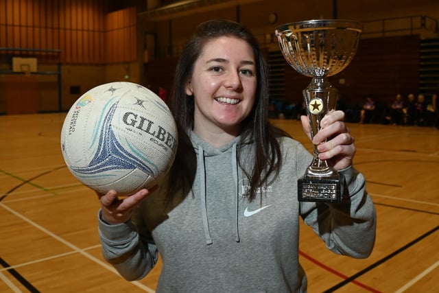 Abbey Barry, Netball Development Officer for Greater Manchester, with the Wigan Walking Netball League trophy.