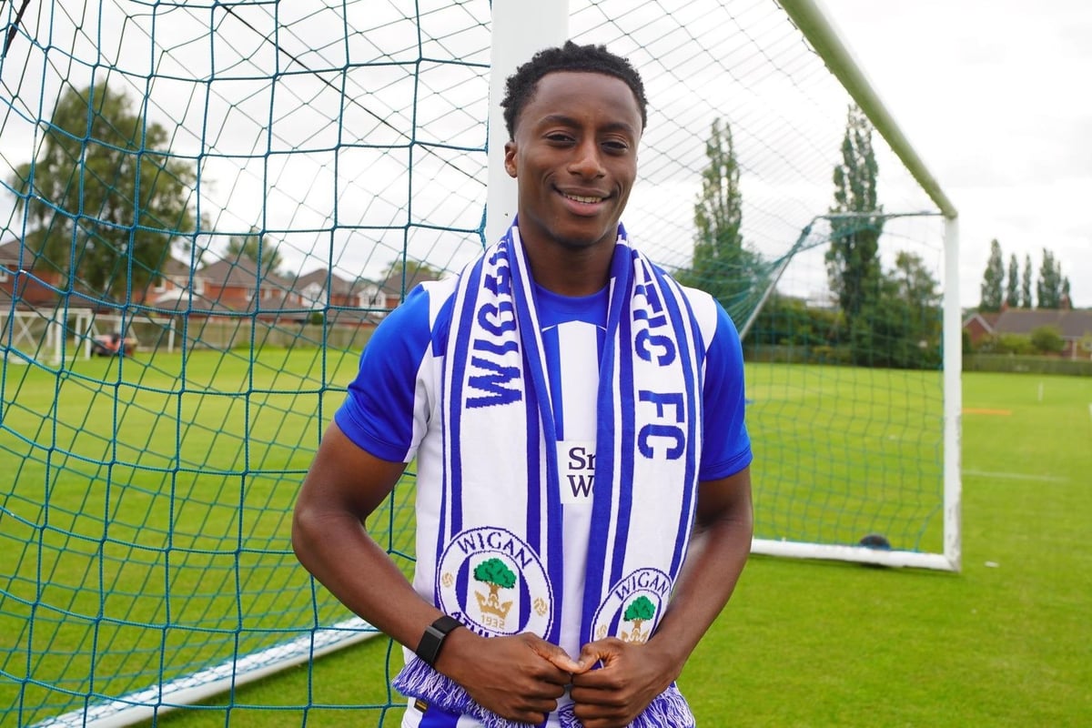 Wigan Athletic make Liverpool defender their seventh summer signing