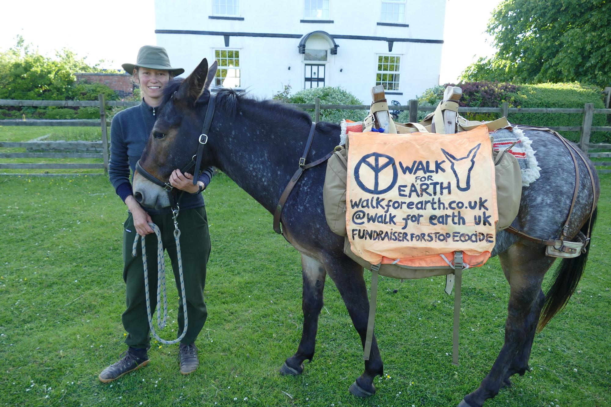 Campaigner and her mule take in Wigan s sights during a 1 000 mile