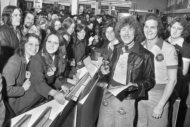 Pop group "Wigan's Ovation" sign copies of their hit single "Skiing in the Snow" in Woolworths store on Standishgate in March 1975.
The record got to number 12 in the hit parade and saw them appear on "Top of the Pops".  They also got to number 38 with "Per-so-nal-ly" in June and number 41 with "Super Love" in November of 1975.