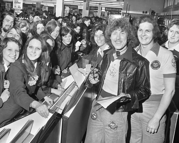 Pop group "Wigan's Ovation" sign copies of their hit single "Skiing in the Snow" in Woolworths store on Standishgate in March 1975.
The record got to number 12 in the hit parade and saw them appear on "Top of the Pops".  They also got to number 38 with "Per-so-nal-ly" in June and number 41 with "Super Love" in November of 1975.