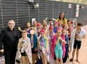 Children celebrate with councillors Chris Ready and Laura Flynn